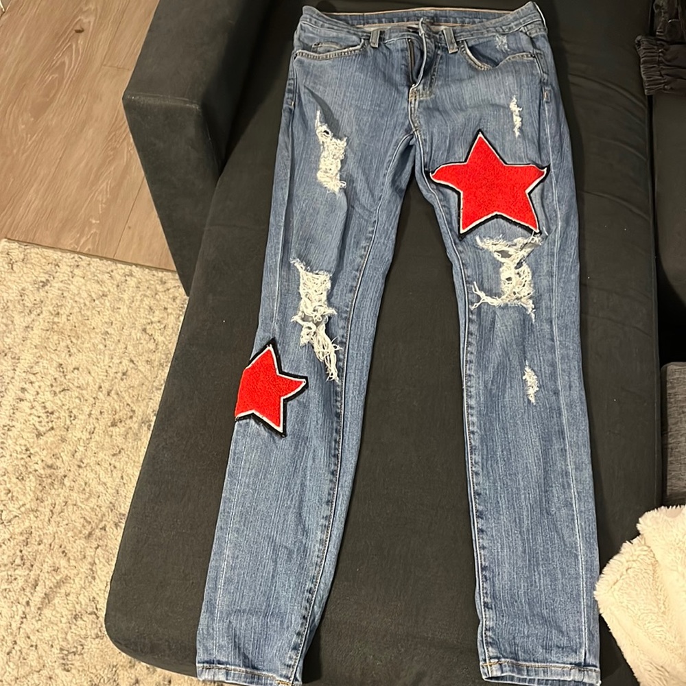 Carmar jeans with rips and red stars